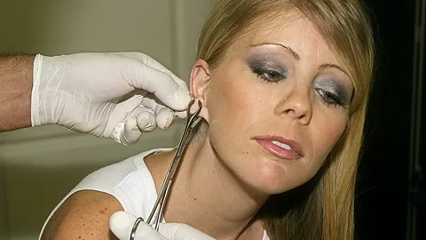 Tiny MILF Tabitha James Gets a Huge Piercing on her Ears - AltErotic