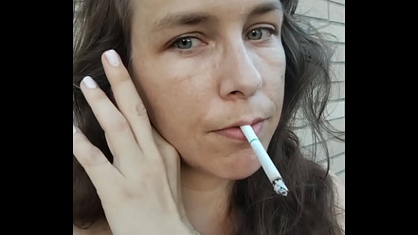 Kelly Kendricks smokes cigarettes in the sun with lots of cleavage