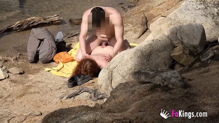 Redhead girl and her cum shower at the beach