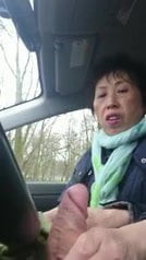 homemade, older chinese lady wanks cock in car