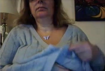 Old gal teases her pussy, rubs tits