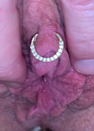 Milf plays with huge pierced clit