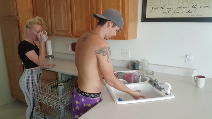 Reach around handjob in the kitch