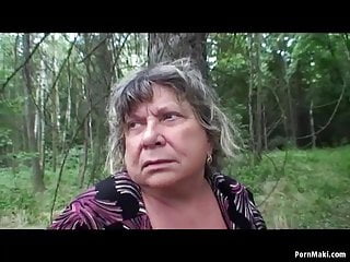 Busty granny having fun in the forest