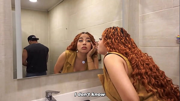 Distracted busty redhead ends up in the men's bathroom and can't resist seeing a big dick