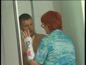 Spex redhead granny gets fingered and fisted after pissing