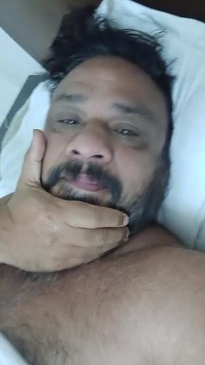 Indian Daddy Lying on the Bed Teasing and Posing for You
