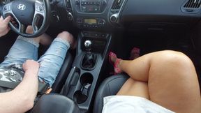 Elegant mature woman in a short skirt and high heels in a taxi in the morning