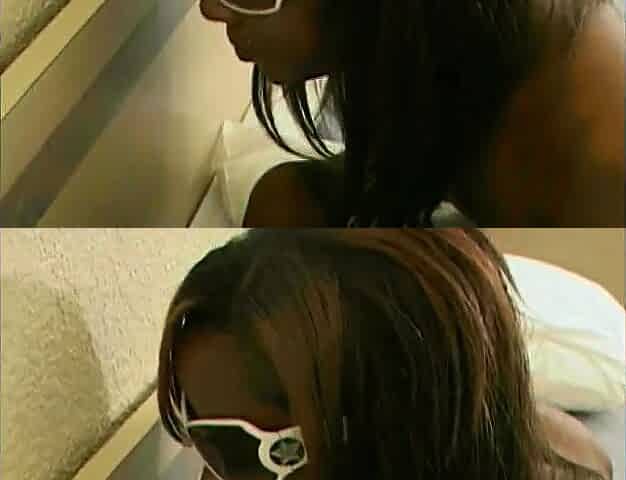 Ebony gets bent over and girl fucks her with strapon cock from behind
