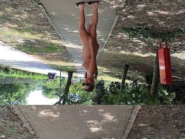 A cute teenage gal walks around the town in nature's garb in the centre of the day and then masturbates