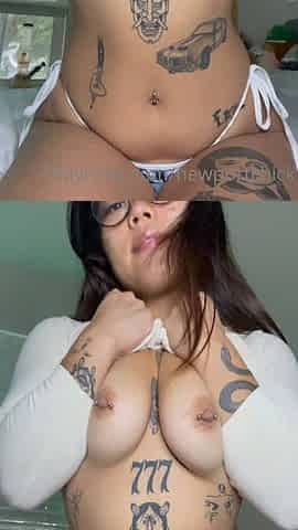 tattooed asian chick rubs her tight pussy