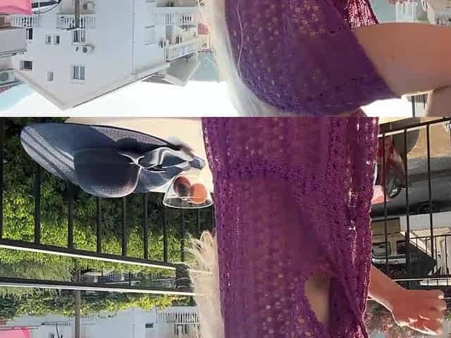 Girl in a cape on a exposed body. Public nudity.
