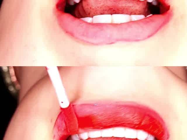 4K Applying red lipstick and smokin' hookah on ebony background