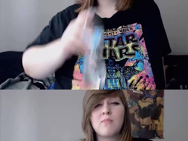 Nerdy chick lifts her T-shirt up to show her boobs