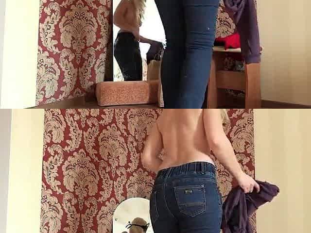 A cutie with a luscious booty tries on stockings and dresses near a mirror. Behind the scenes. Homemade.