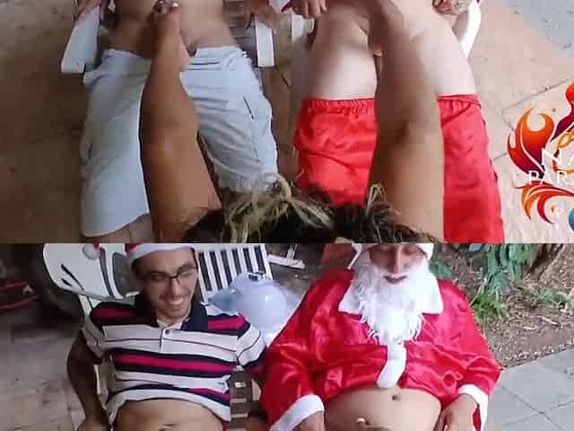 Santa Claus doing a footjob with 2 cocks at the same time.