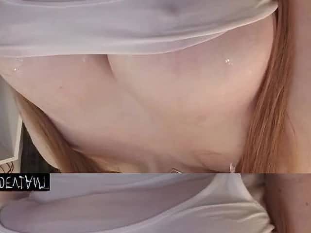 Redhead Spiting on Large Fake Titties Soaking White Shirt PREVIEW