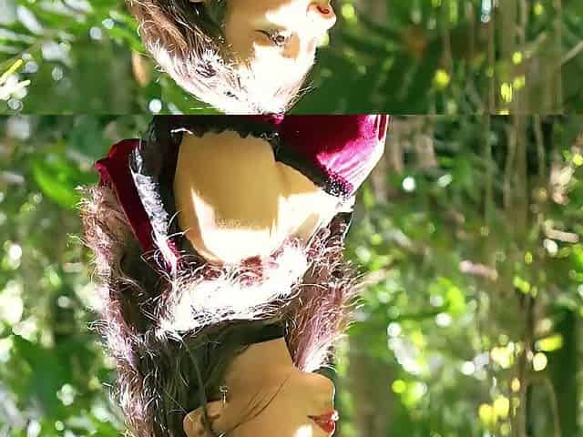 Little Red Riding Hood walking alone in the forest