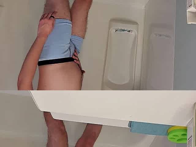 Despairing Youthful Dude Boxer Pissing in Shower