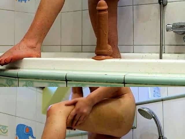 Redhead babe cums with her favorite toy after a shower.