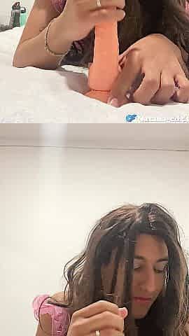 Natalia Valera uses her throat to put a fuck-rubber on her vibrator and rides it