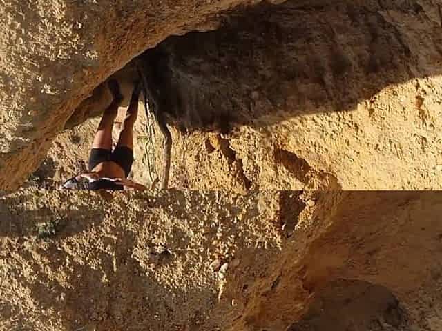 Sexy brunette hair risks masturbating on a public beach whilst doing her exercise
