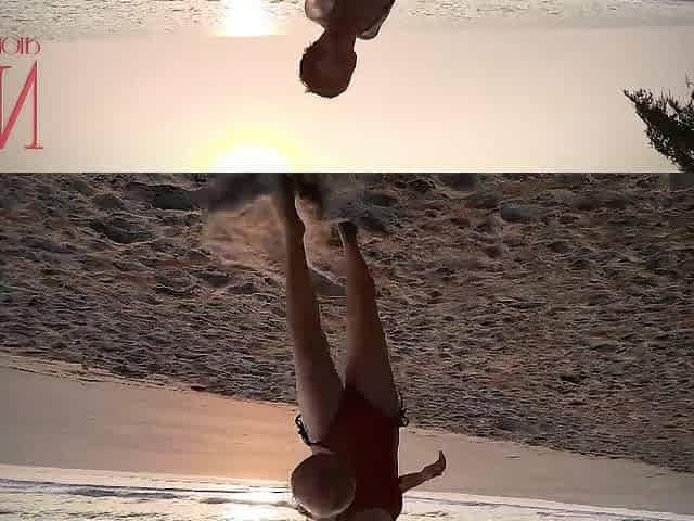 Valuable lady at lonely nudist beach. Red swimsuit. Red bikini. Coconut
