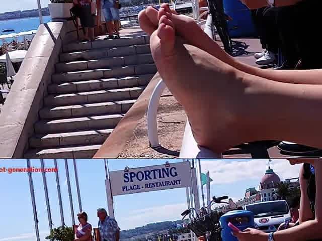 This Woman With Red Toe Nails Relaxes Her Luscious Feet On The Railing At The Beach
