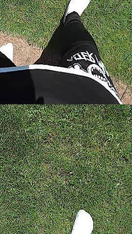 Wearing white socks, ebony leggings, and a lengthy ebony shirt