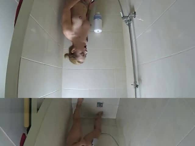Solo female masturbation in the public gym shower. Hidden cam