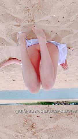 Outdoor solo masturbation scene with curly blonde
