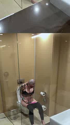 Breasty beauty watches porn and jerks off on the biffy, peeping