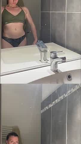 Gym angel playing with her large sextoy below the shower