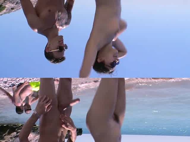 Beautiful brunette gives a blowjob on the beach.