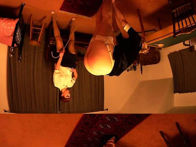 Sexy brunette lesbians in stockings strap on fucking