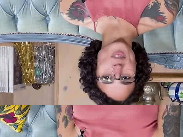 Tattooed black-haired masturbates with her fingers
