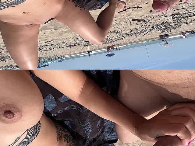 Nudist pair fingering on public beach