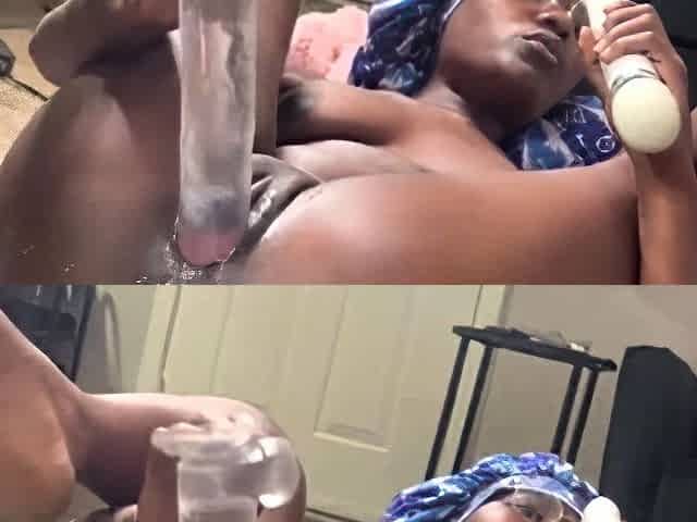 Black chick oils her ass and toy fucks it