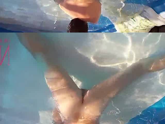 Elegant and supple playgirl, swimming underwater in the outdoor swimming pool. two two
