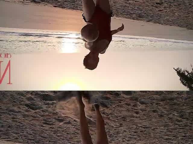 Good lady at lonely nudist beach. Red swimsuit. Red bikini. Coconut