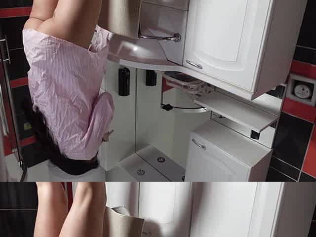 Sexy tiny brunette hair sweetheart in the washroom prepares for a night out in pants and a shirt