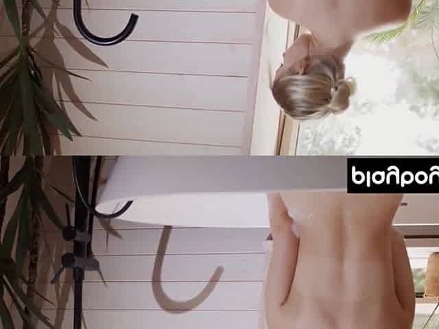 Cute all natural blond honey posing in nature's garb in the washroom