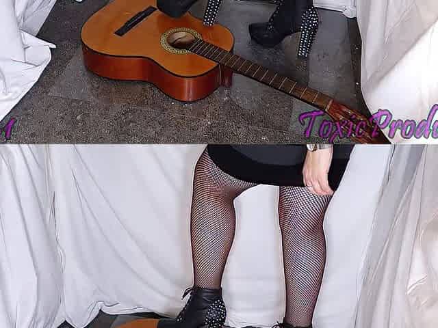 Acoustic guitar crushed underneath hawt boots