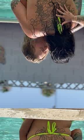 Hot lesbo makeout with back tattoo visible
