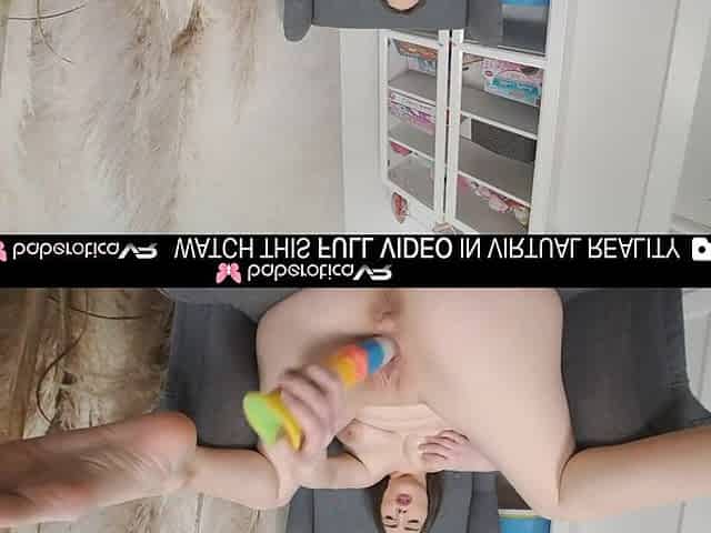 Solo brunette hair Aleya Sun masturbates with a rainbow colored vibrator in VR.