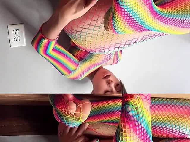 Teen in Rainbow Fishnets Fingers Herself