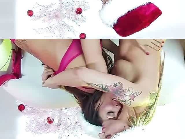 Tattooed honey and buddy in santa hats oral sex