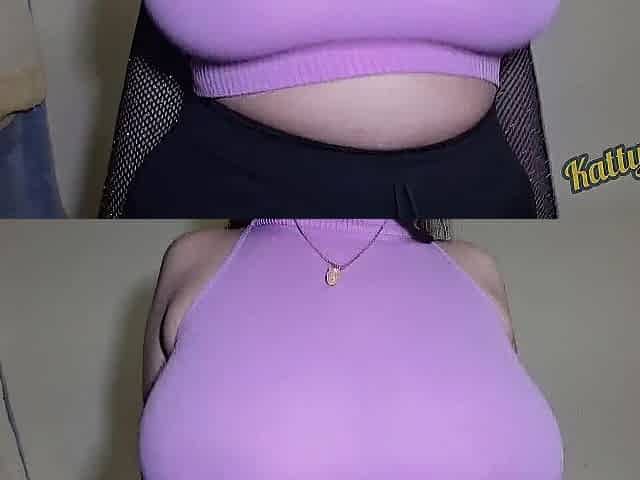 Katty Milk shakes her Giant Natural Titties in PINK CLOTHING in front of the camera / Taking clothing off