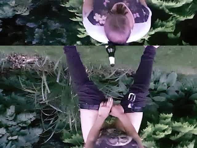 pissing and screwing a bottle in the park