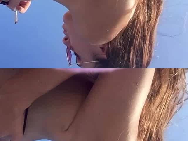 Artemisia Love Smoking a Cigarette Outdoor at the Beach